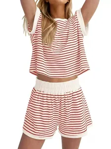 Detail view of red and white striped two-piece summer set with elastic waist shorts.