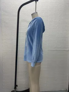 Side view of a light blue velvet drawstring hoodie on a mannequin for detail view.