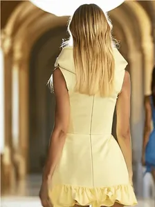 Back view of a chic light yellow hooded sleeveless mini dress with a ruffle hem details.