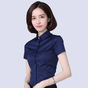 Detail showing the professional fit of a navy blue short-sleeve women's office shirt