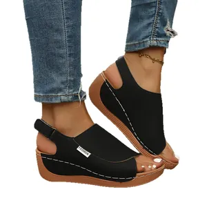 Elegant women's black platform wedge sandals with adjustable straps and white stitching
