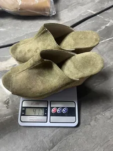 Weight measurement showing these olive green peep-toe wedge sandals on a scale