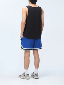 Back view of men's blue mesh athletic shorts with striped hem and black tank top