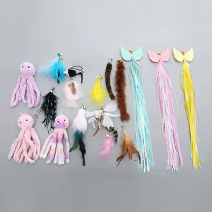 Diverse set of colorful cat teaser wand replacement heads with feathers and octopus shapes.