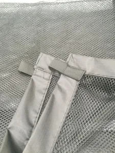 Close-up detail of the durable grey mesh fabric and elastic straps on a pet safety net