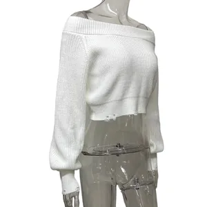 Detail view of a white sexy off-the-shoulder cropped knit sweater with distressed hem