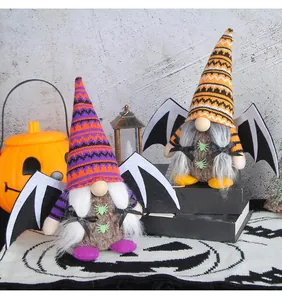 Adorable plush Halloween gnomes with bat wings and festive spider decorations