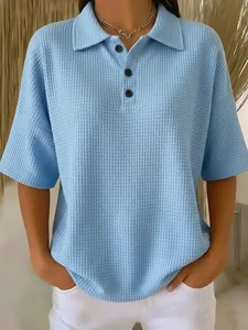 Close-up detail of women's waffle knit short sleeve Polo shirt with button collar