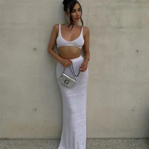 Sexy white knit two-piece set featuring a stylish crop top and a matching long maxi skirt.