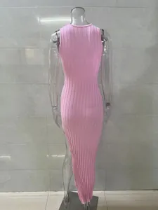 Detailed back view of a pink ribbed sleeveless bodycon maxi dress with side slit