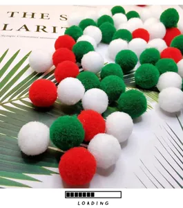 Detail view of soft plush cat toy balls in red, green and white festive colors