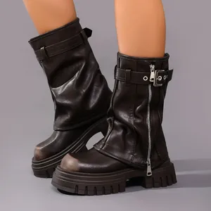 Detailed view of brown square-toe platform motorcycle boots with distressed finish