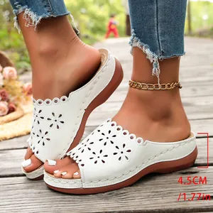 White peep-toe wedge sandals with floral cut-out design and 4.5cm platform