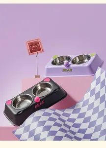 Modern stainless steel double pet bowls with cute bear design and pastel colored base.