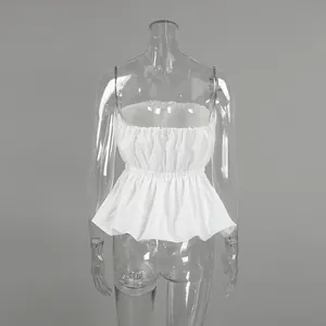 Elegant white strapless peplum top with gathered waist, back view on mannequin