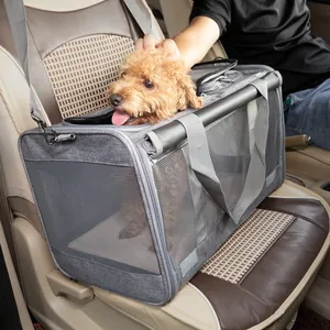 Portable breathable grey mesh pet carrier bag for small dogs and cats on a car seat