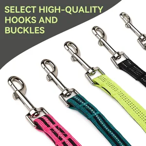 Close-up view of high-quality silver metal hooks and buckles on colorful pet dog traction ropes