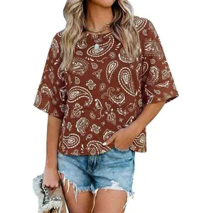 Detailed view of women's brown paisley print loose top featuring flare half sleeves and round neck