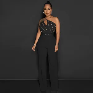 Elegant one-shoulder black jumpsuit featuring gold stud details and chic wide-leg design.