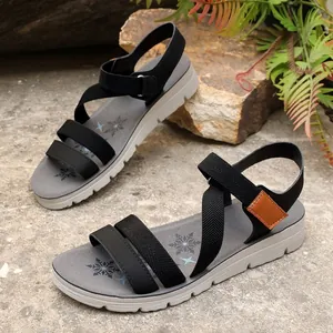 Lightweight sporty sandals with black elastic straps and grey snowflake-patterned insoles