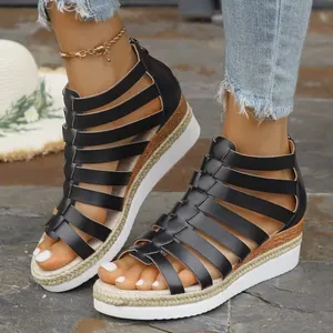 Black gladiator platform sandals with multi-strap design and convenient back zipper