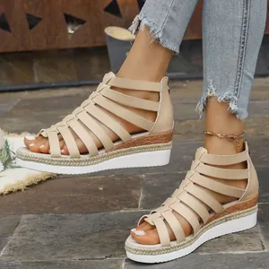 Elegant beige gladiator wedge sandals featuring platform soles and a convenient back zipper