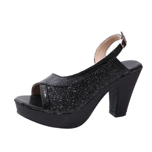 Detailed side view of black glitter high heel sandals with platform and chunky heel