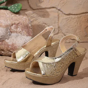 Detail view of gold glitter high-heeled sandals with platform and chunky heel design.