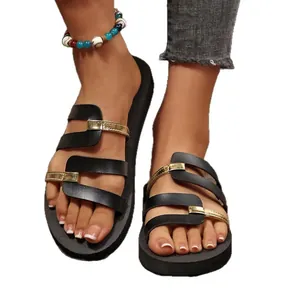Stylish black and gold color-block flat slide sandals for women's casual beach wear