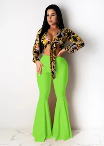 Detail of floral print tie-front crop top and neon green flared pants set