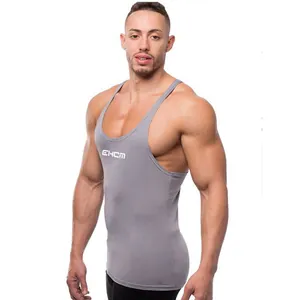 Grey slim-fit fitness stringer tank top for men showing muscular chest and shoulder details