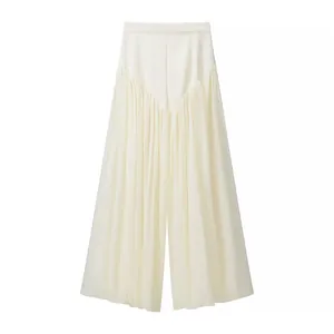 Detailed view of off-white wide-leg trousers with pleated fabric and V-shaped waist