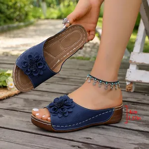 Detail of navy floral wedge sandals for women with 4cm heel height measurement