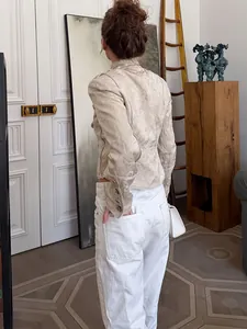 Detailed back view of a beige jacquard jacket in elegant New Chinese floral style