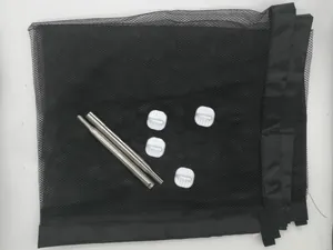Detailed view of portable black mesh pet safety gate set including poles and hooks