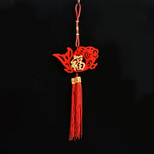 Detailed view of traditional Chinese New Year felt ornament with gold Fu character and red tassel
