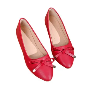 Elegant red pointed-toe flat shoes featuring a bow detail and textured finish for wedding.