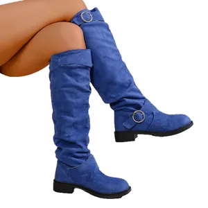 Blue slouchy flat western knight boots with decorative buckles on a white background
