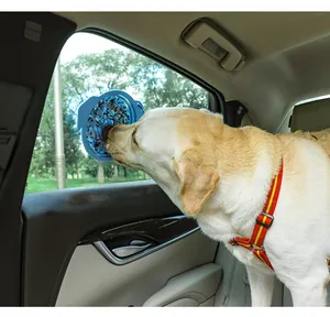 Detail showing silicone suction lick mat attached to car window for dog enrichment