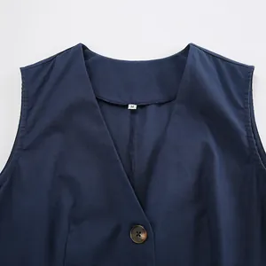 Detailed close-up view of navy blue cotton linen vest featuring V-neckline and size M tag