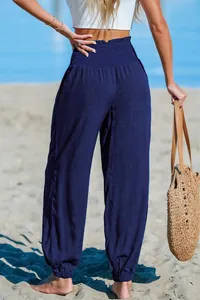 Back view of navy blue loose beach jogger pants with smocked high waist