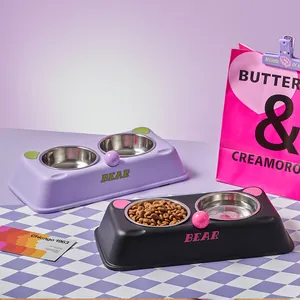 Detailed view of purple and black double stainless steel pet bowls with bear ears