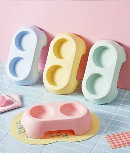 Pastel colored double pet bowls for food and water in blue, pink, yellow and green