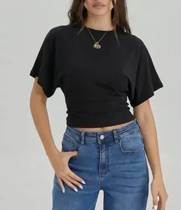 Detailed view of women's black round neck T-shirt with cinched ruched waist design