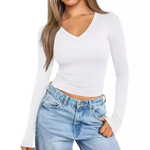 Detail view of a white long-sleeved V-neck T-shirt with a slim fit design for women.