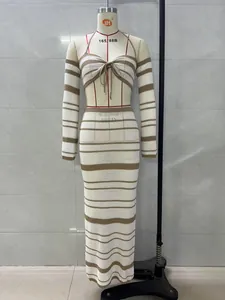 Detail view of striped crochet two-piece set with halter top and maxi skirt on mannequin.