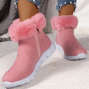 Close-up of pink winter snow boots with plush faux fur trim and side zipper detail.
