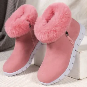 Close-up of pink snow boots with cozy fur trim and soft suede texture