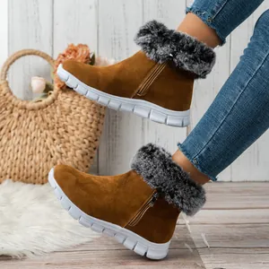 Cozy brown suede snow boots with grey faux fur trim and durable white sole