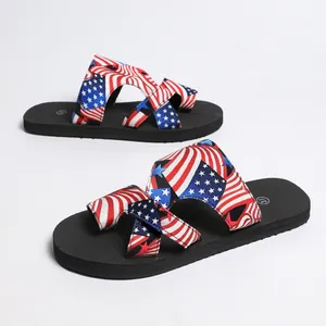 Women's flat toe-loop sandals featuring a vibrant American flag pattern for summer